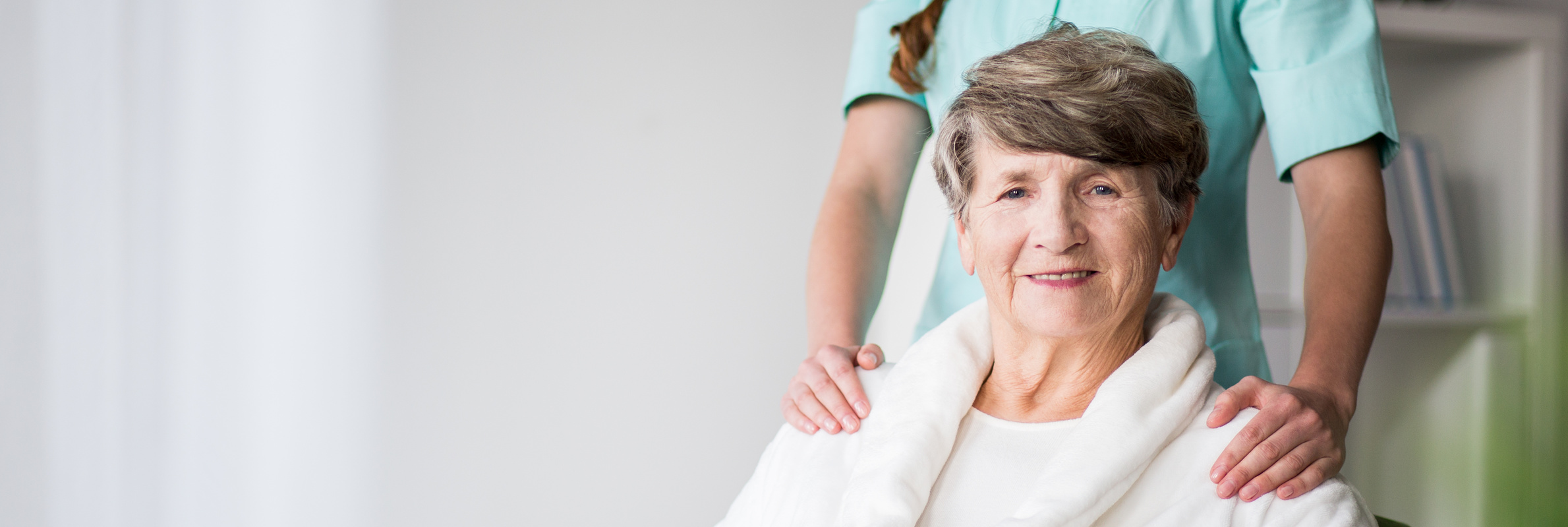 Elderly woman in nursing home and nurse